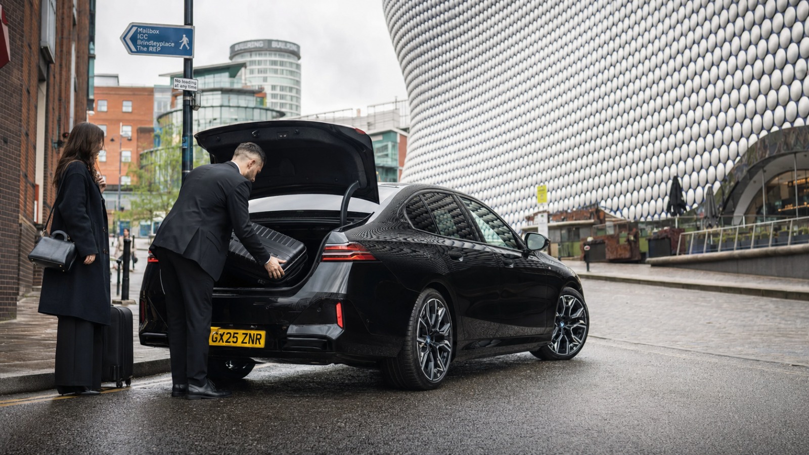 Fixed-price taxi collecting a passenger in Birmingham city centre for a Heathrow transfer