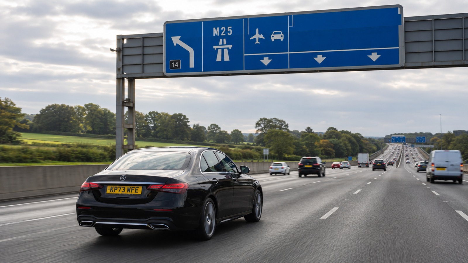 Executive saloon taxi approaching Heathrow Terminal 4 via the M25 Junction 14 and A3113 southern airport approach