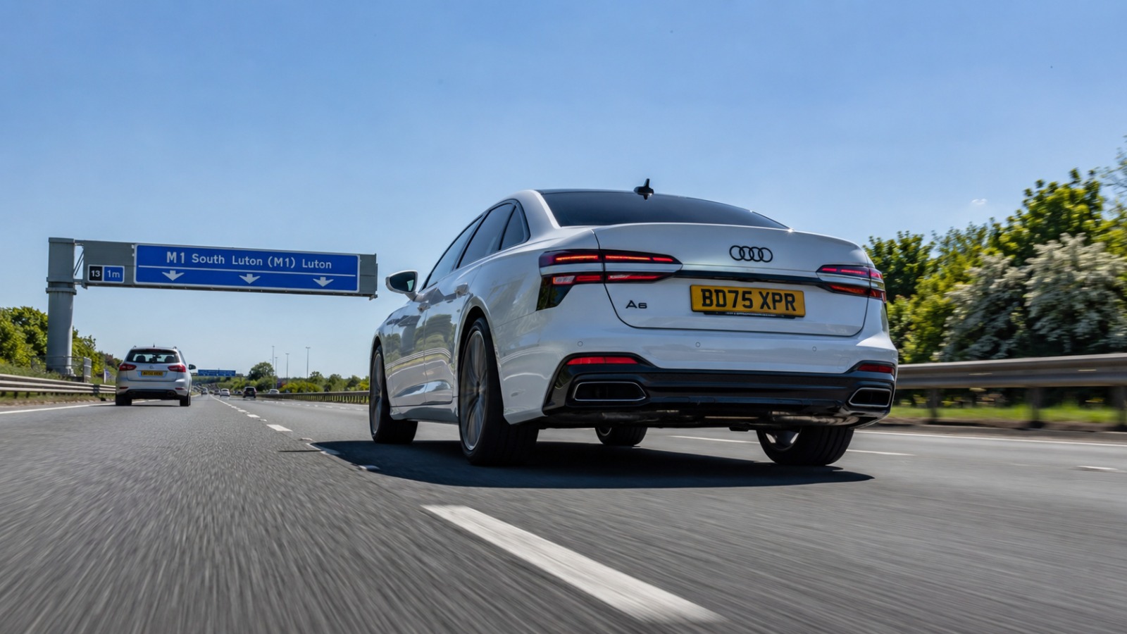 White Audi A6 Northampton to Luton Airport taxi on M1 South at junction 13 midday